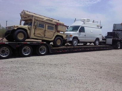 humv and van on rgn trailer 2 truck transport photo