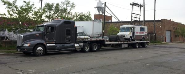 bread truck on trailer truck transport photo
